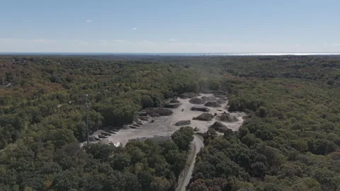 Aerial view of active construction site in wooded area Stock Footage 289338661