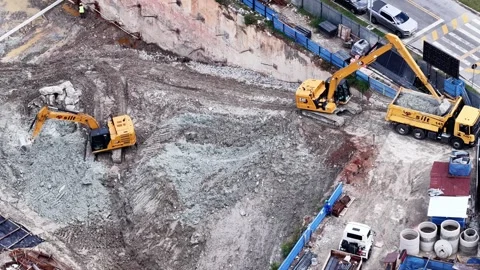 Aerial View of Active Construction Site with Crane and Excavators Stockbeeldmateriaal 344478675