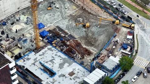 Aerial View of Active Construction Site with Crane and Excavators Stock Footage 344478680
