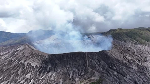 Aerial View of Active Mount Bromo Crater Emitting Thick Volcanic Smoke East Video stock 344892263