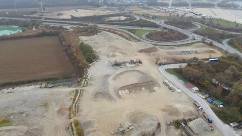 Aerial view of active sand quarry in industrial zone in foggy autumn Bavaria Stock Footage 291849242