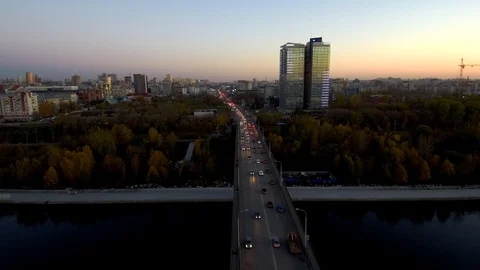 Aerial view of the active traffic on the bridge across the big river in the Stock Footage 116502874