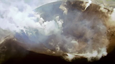 Aerial view of an active volcano crater steaming Stock Footage 337029443