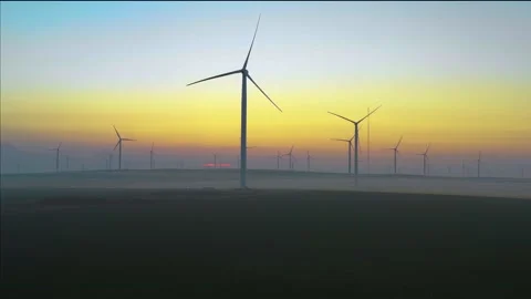 Aerial view of aeolian generators wind turbine farm in a wheat field Wind energy Stock Footage 150590908