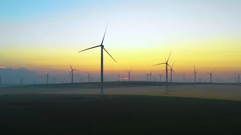 Aerial view of aeolian generators wind turbine farm in a wheat field Wind energy Stock Footage 150590969