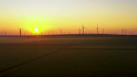 Aerial view of aeolian generators wind turbine farm in a wheat field Wind energy Video stock 150591208