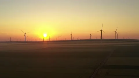 Aerial view of aeolian generators wind turbine farm in a wheat field Wind energy Video stock 150591310