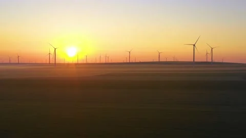 Aerial view of aeolian generators wind turbine farm in a wheat field Wind energy Video stock 150591646
