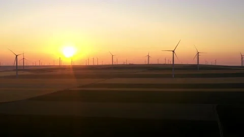 Aerial view of aeolian generators wind turbine farm in a wheat field Wind energy Video stock 150591701