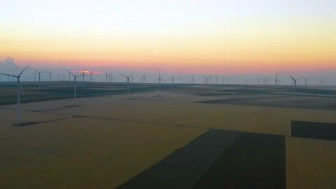 Aerial view of aeolian generators wind turbine farm in a wheat field Wind energy Stock Footage 150608082