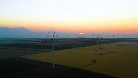Aerial view of aeolian generators wind turbine farm in a wheat field Wind energy Stock Footage 150608083
