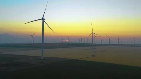 Aerial view of aeolian generators wind turbine farm in a wheat field Wind energy Video stock 150622915