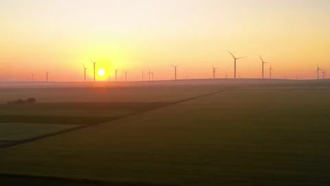 Aerial view of aeolian generators wind turbine farm in a wheat field Wind energy Stock-Footage 150623612