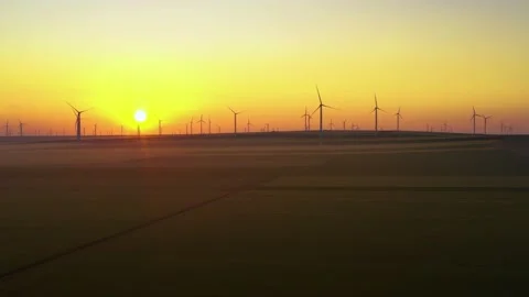 Aerial view of aeolian generators wind turbine farm in a wheat field Wind energy Video stock 150623779
