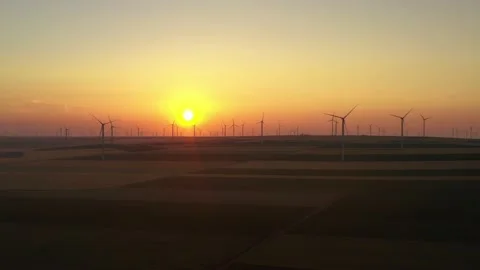 Aerial view of aeolian generators wind turbine farm in a wheat field Wind energy Video stock 150623970