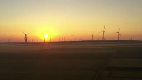 Aerial view of aeolian generators wind turbine farm in a wheat field Wind energy Video stock 150624096