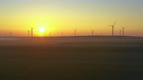 Aerial view of aeolian generators wind turbine farm in a wheat field Wind energy Video stock 150624568