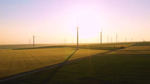 Aerial view of aeolian generators wind turbine farm in a wheat field Wind energy Video stock 150625396