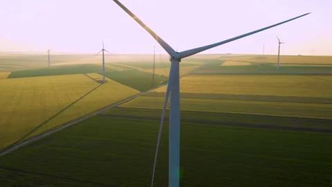 Aerial view of aeolian generators wind turbine farm in a wheat field Wind energy Video stock 150626242