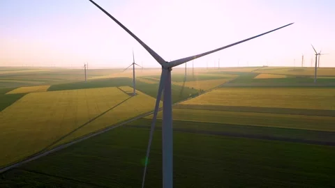 Aerial view of aeolian generators wind turbine farm in a wheat field Wind energy Stock-Footage 150627173