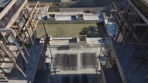 Aerial View: Aerial view of engineers and workers putting together sections of a Stock Footage 296098027