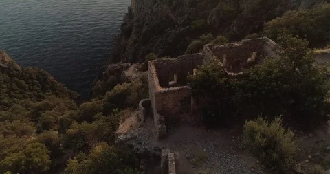 Aerial view of the Af Kule Monastery embdedded in the steep rock of Fethiye. Stock Footage 93254707