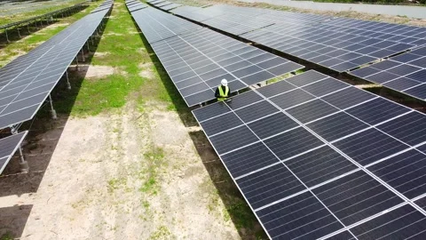 Aerial view of african worker engineer checking and arrange solar panels Stock Footage 291637791