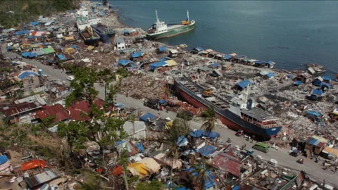 Aerial view of aftermath of Typhoon Haiyan showing ships washed ashore 库存影片 334392604