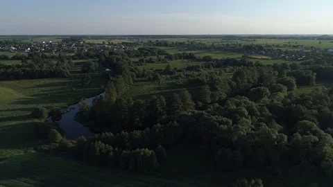 Aerial view against the forest with rivers and a village Stock Footage 101978752