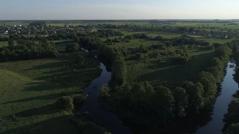 Aerial view against the forest with rivers and a village Stock Footage 101978784
