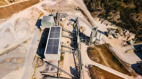 Aerial view of aggregate processing factory building in quarry. High angle .. Stock Photos