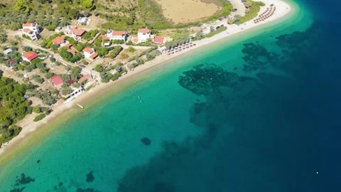 Aerial view of Agios Dimitrios Beach on the island of Alonnisos, Greece, with Stock Footage 346687535