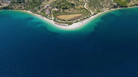 Aerial view of Agios Dimitrios Beach on Alonnisos island, Greece, with curved Stock Footage 346711390