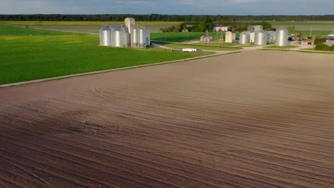 Aerial view with a agricultural complex and an animal farm and the grain silos. Stock Footage 277452943