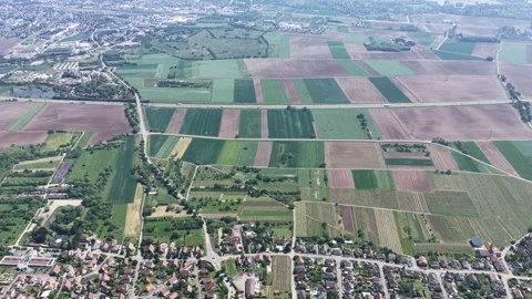 Aerial view of agricultural fields and Selestat town, France. Vídeos de archivo 334772939