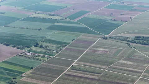 Aerial view of agricultural fields and rural landscape, France. 動画素材 334773059