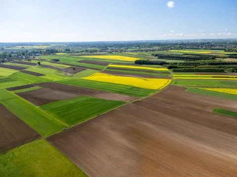 Aerial view of agricultural fields in patchwork pattern showcasing crop rotation Stock Photos