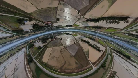 Aerial view of agricultural fields reflecting in water during cloudy weather Vidéo 345399416