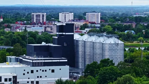 Aerial view of an agricultural processing plant with grain storage silos Stock Footage 337387543