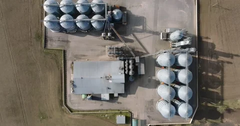 Aerial view of agro-industrial complex with silos and grain drying line Stock Footage 237516000