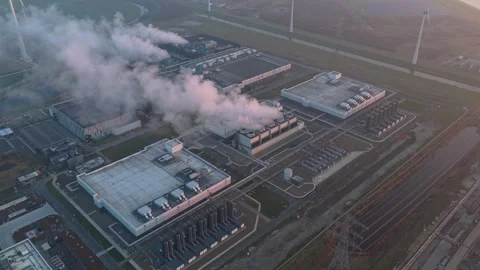 Aerial view of ai cloud data center emitting steam at sunrise Stock Footage 334056552