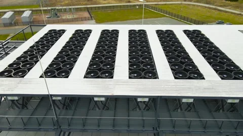 Aerial View of an Ai Data Center Cooling System With Spinning Fans on a Rooftop Stock Footage 333100905
