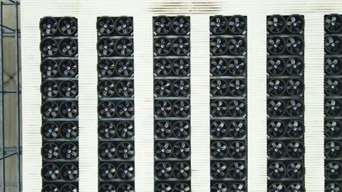 Aerial View of AI Data Center Cooling System Fans Spinning on a Rooftop Stock Footage 333100934