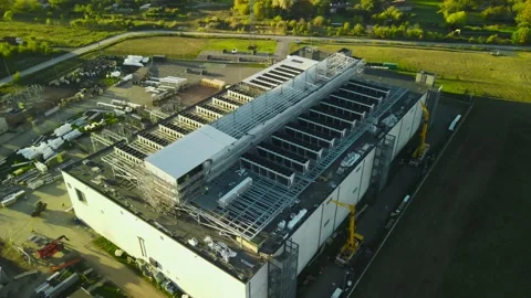 Aerial view of an ai data center under construction during sunset Stock Footage 347574716