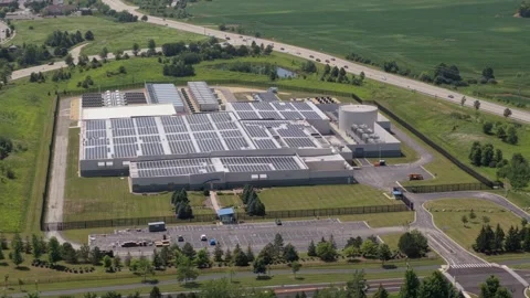 Aerial view of a AI industrial facility with solar panels on the roof Stock Footage 340116082
