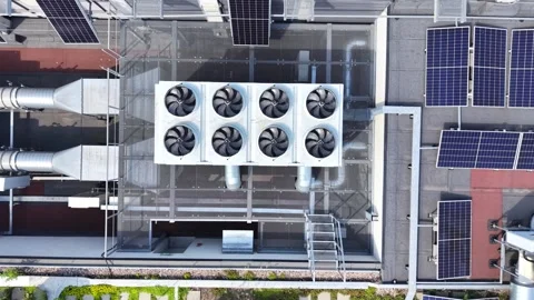 Aerial view of air conditioning system on commercial building rooftop, featuring Stock Footage 347787080