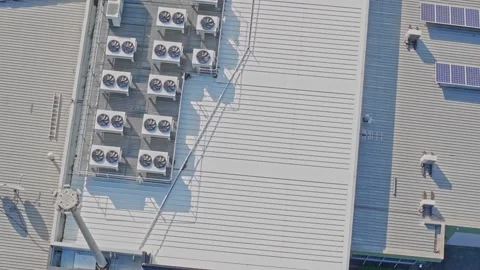 Aerial view of air conditioning units and solar panels on a rooftop Stock Footage 340570130