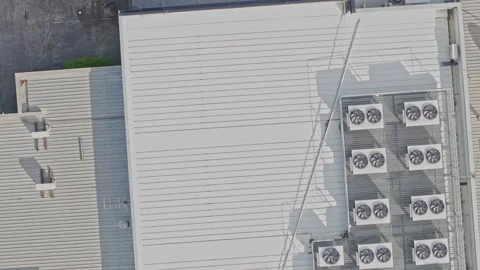Aerial view of air conditioning units on an industrial building roof Stock Footage 340576225