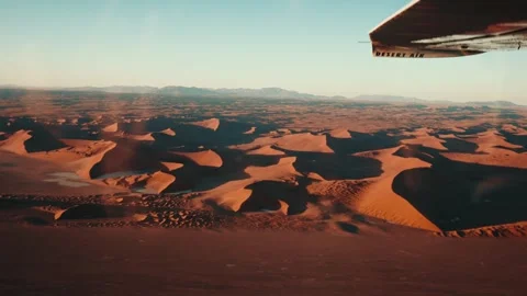 Aerial view from an airplane of dunes in Namibia Africa Stock Footage 299944615