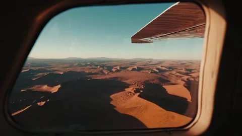 Aerial view from an airplane of dunes in Namibia Africa Stock Footage 299944717